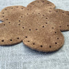Suede flower shaped patch 87mm diameter with stitch holes brown colour side view