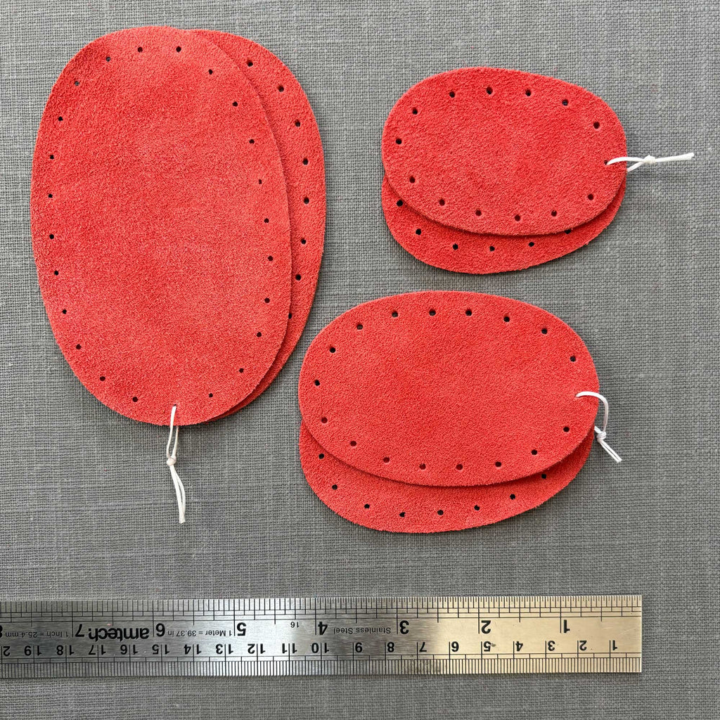 Coral red suede oval patches in three sizes.