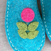 Joe's Toes Flora slippers close up in Turquoise and Purple felt with fuchsia flower trim