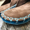 Joe's Toes luxe mule slippers in brown suede showing turquoise crepe rubber soles close up
