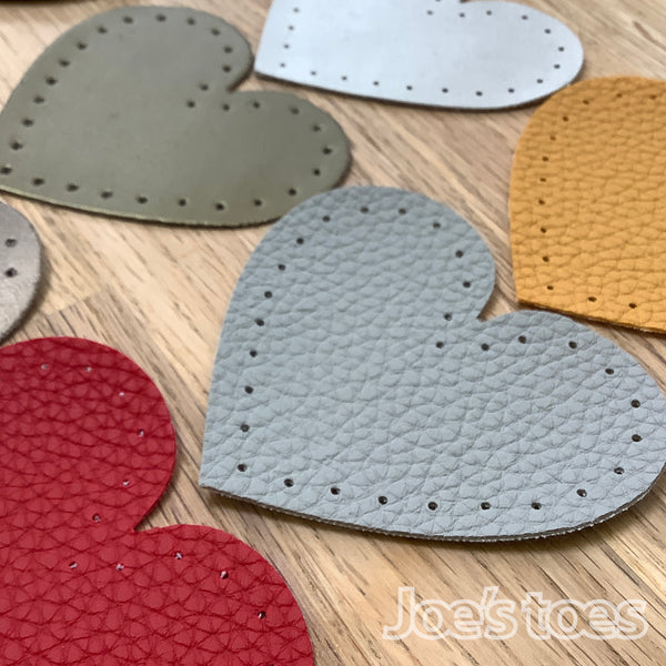 Joe's Toes toffee heart shaped patch with stitch holes