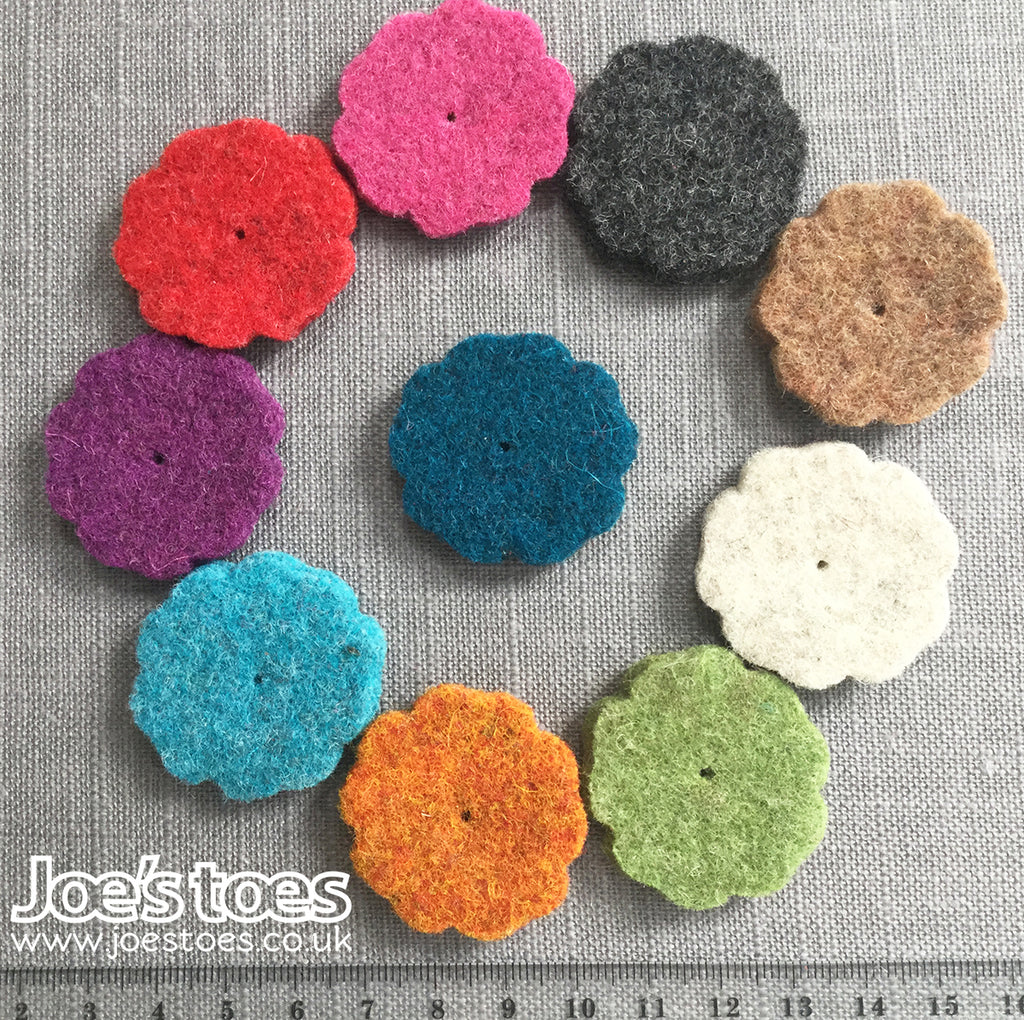 small flowers in thick wool felt in ten different colours