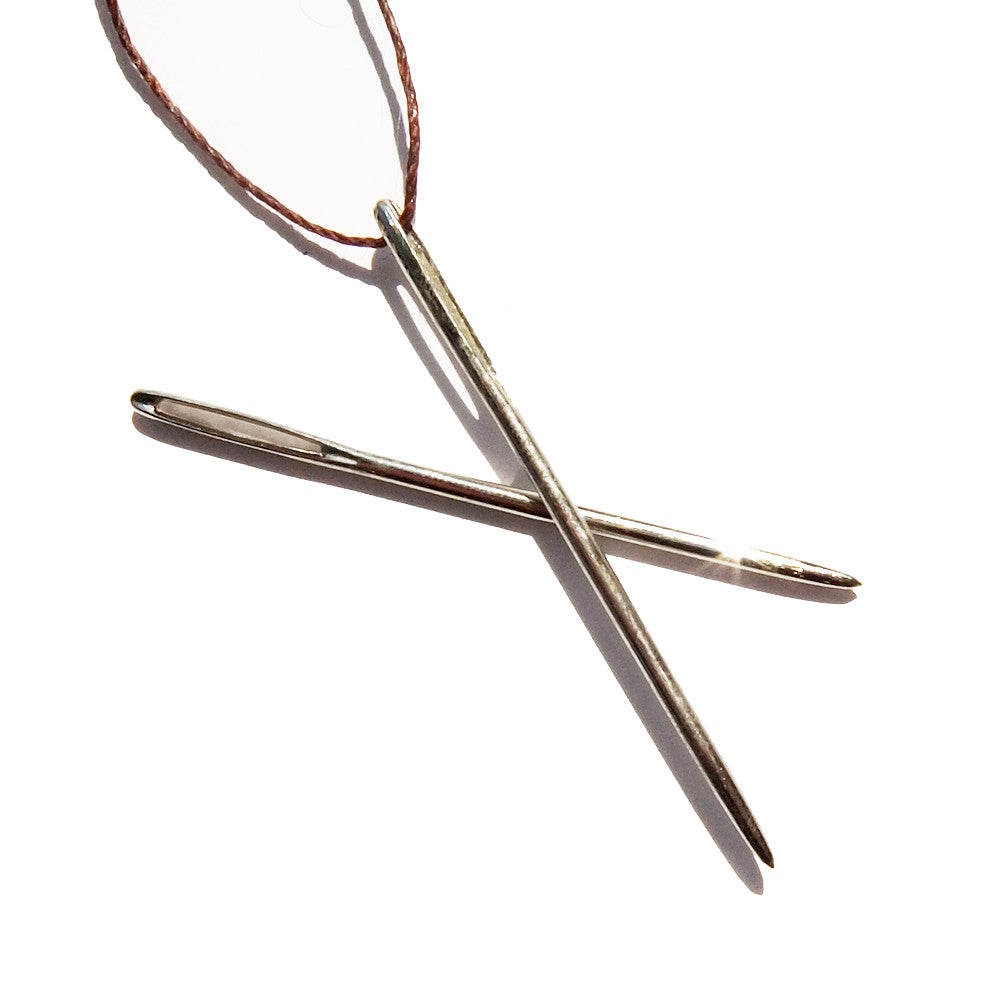 A spare pair of Joe's Toes blunt metal sewing needles